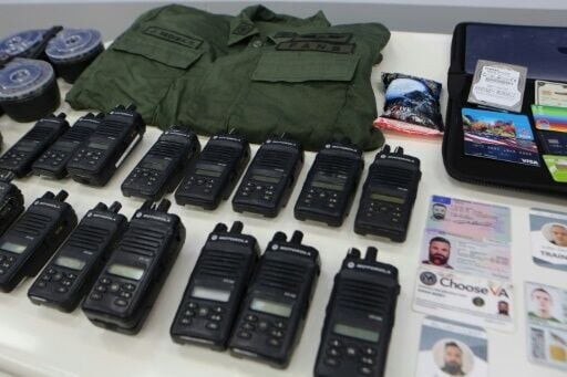 The Venezuelan presidency released this picture in May 2020 showing identification cards, two-way radios and other military gear allegedly seized from those involved in the failed coup attempt
